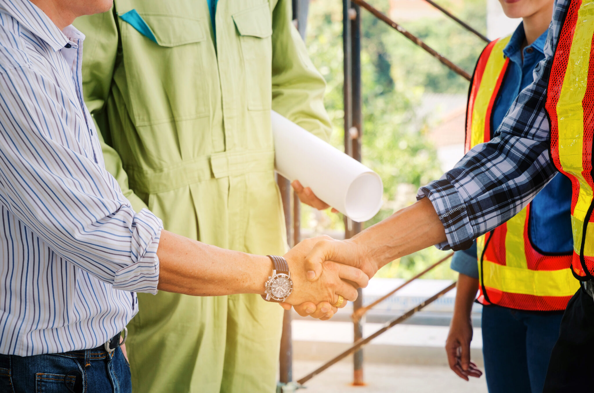 engineer and technician contractor shaking hands after finishing up a business meeting to greeting start up project contract in construction site building, successful, partnership, teamwork concept